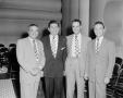 Photograph: [Photograph of Roy Bacus and three other men]