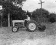 Photograph: [Doc Rhuman on a Ford tractor]