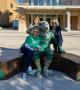 Photograph: [Three NTSU grads with Scrappy statue]