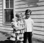 Photograph: [Photograph of Tim and Carol Williams posing with a doll]