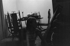 Primary view of object titled '[Photograph of a girl sitting on the floor, 2]'.