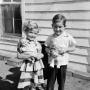 Photograph: [Photograph of Carol and Tim Williams posing with dolls]