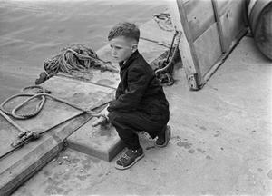 Primary view of object titled '[Photograph of Tim Williams on a dock]'.