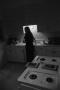 Photograph: [Photograph of Jamye in a kitchen]