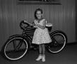 Photograph: [Photograph of a girl with a bicycle, 2]