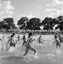 Photograph: [Families playing at the beach]