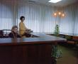 Primary view of [Two women at reception desk]