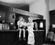 Photograph: [Woman and a child at an establishment, 3]