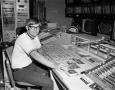 Photograph: [Ronnie Clark at a control desk]