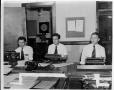 Photograph: [Three men using word processors]