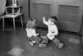 Photograph: [Photograph of Pam and Byrd Williams IV playing on the floor]