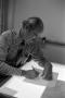 Photograph: [Photo of Ken Carter using a light table]