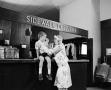 Photograph: [Woman and a child at an establishment, 5]