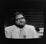Photograph: [Man with a beard on television]