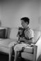 Photograph: [Photograph of Byrd Williams IV with a cat, 2]