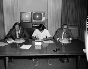 Primary view of object titled '[Contract signing with minority representatives]'.