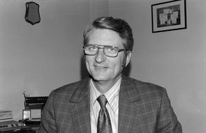 Primary view of object titled '[Russ Thornton in a plaid suit jacket]'.
