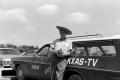 Primary view of [Photograph of Wayne Brown next to a WBAP news vehicle]