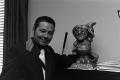 Primary view of [Guy Woodward Jr. smiling with a statue]