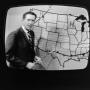 Photograph: [Frank Mills with a weather forecast]