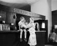 Photograph: [Woman and a child at an establishment, 2]