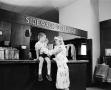 Photograph: [Woman and a child at an establishment, 4]