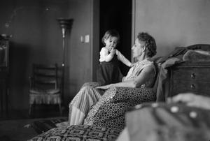 Primary view of object titled '[Photograph of Irene Williams with Alyse in her lap]'.