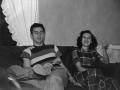 Photograph: [Photograph of a young man and woman sitting on a couch]