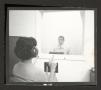 Photograph: [Woman participates in a hearing evaluation, 3]