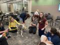 Thumbnail image of item number 1 in: '[Maren Garcia and Abigail Mueller with therapy dog]'.