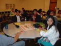 Primary view of [Students seated around a table at APAEC]