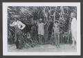 Photograph: [Photograph of five individuals standing in tall plants]