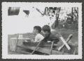 Photograph: [Two boys playing outdoors]