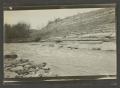 Photograph: [River next to a hill]