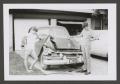 Photograph: [Photograph of two teenage boys by a wrecked automobile, 2]