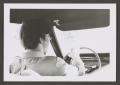 Photograph: [Photograph of a teenage boy driving an automobile]