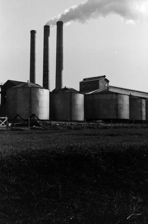 Primary view of object titled '[Factory with silos and smokestacks]'.