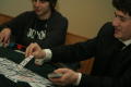 Photograph: [Jonathan Gallegos dealing cards at a table at UNT's Casino Night]