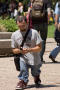 Photograph: [UNT student walking and texting on campus]