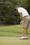 Photograph: [UNT golf player practicing]