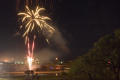 Photograph: [Firework fountains and spark burst at lake]