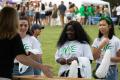 Photograph: [Photograph of three tailgaters in Unite t-shirts, 2]