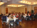 Thumbnail image of item number 1 in: '[Audience around tables at MC event, 1]'.