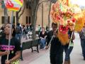 Photograph: [Students performing a dragon dance in the Library Mall]