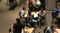 Photograph: [Students gathered at tables in Syndicate 2]