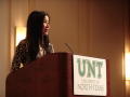 Photograph: [Lisa Ling speaking behind UNT podium]