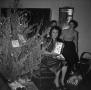 Thumbnail image of item number 1 in: '[Photograph of three women by a Christmas tree]'.