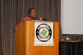 Photograph: [Woman speaking from podium at 2012 TABPHE conference]