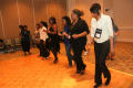 Photograph: [Women lined up to dance at 2012 TABPHE conference 4]