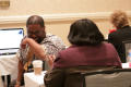 Photograph: [People laughing in workshop at 2012 TABPHE conference]